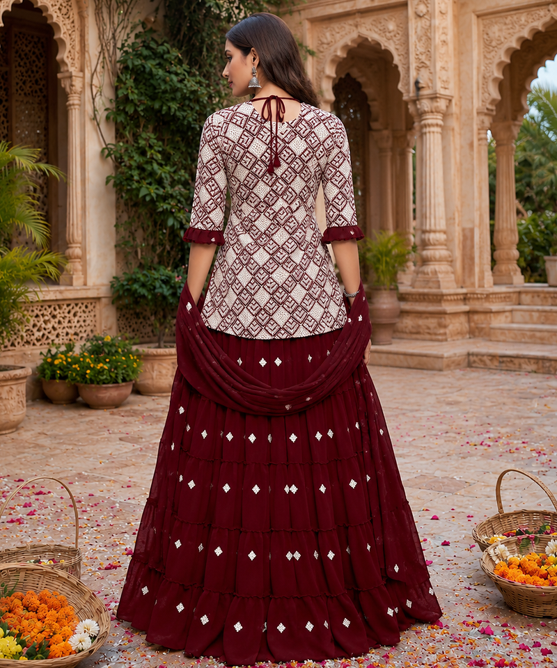 Maroon Elegant Embroidered Kurti With Flowy Sharara And Soft Net Dupatta Perfect For Festive And Wedding Looks