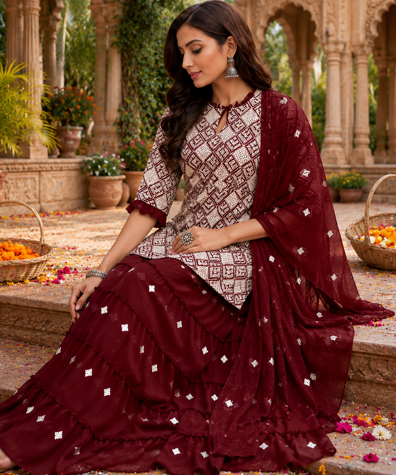 Maroon Elegant Embroidered Kurti With Flowy Sharara And Soft Net Dupatta Perfect For Festive And Wedding Looks