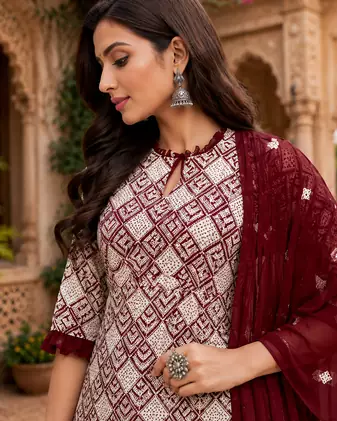 Maroon Elegant Embroidered Kurti With Flowy Sharara And Soft Net Dupatta Perfect For Festive And Wedding Looks