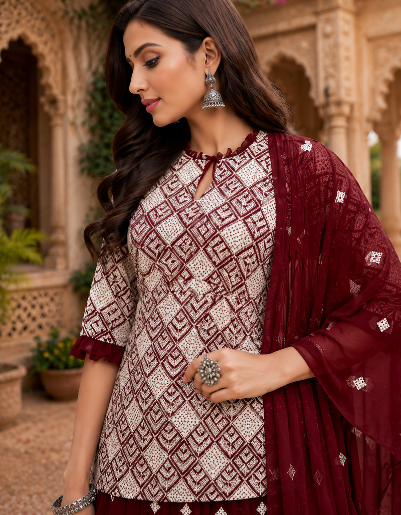 Maroon Elegant Embroidered Kurti With Flowy Sharara And Soft Net Dupatta Perfect For Festive And Wedding Looks