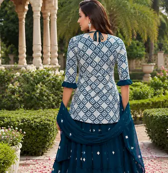 Teal Blue Elegant Embroidered Kurti With Flowy Sharara And Soft Net Dupatta Perfect For Festive And Wedding Looks