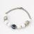 white beaded evil eye bracelet