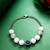 white beaded evil eye bracelet