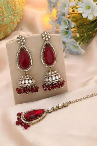 Maroon color kundan earrings tikka set