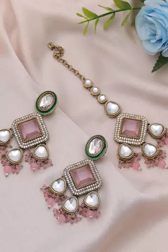 Light pink color kundan earrings tikka set