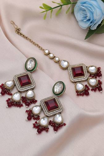 Maroon color kundan earrings tikka set