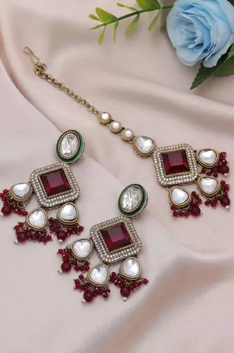 Maroon color kundan earrings tikka set