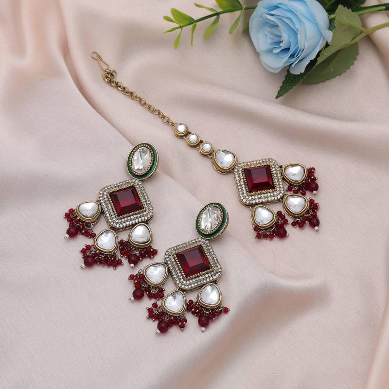Maroon color kundan earrings tikka set