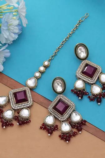 Maroon color kundan earrings tikka set