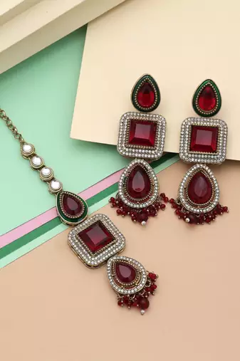 Maroon color kundan earrings tikka set