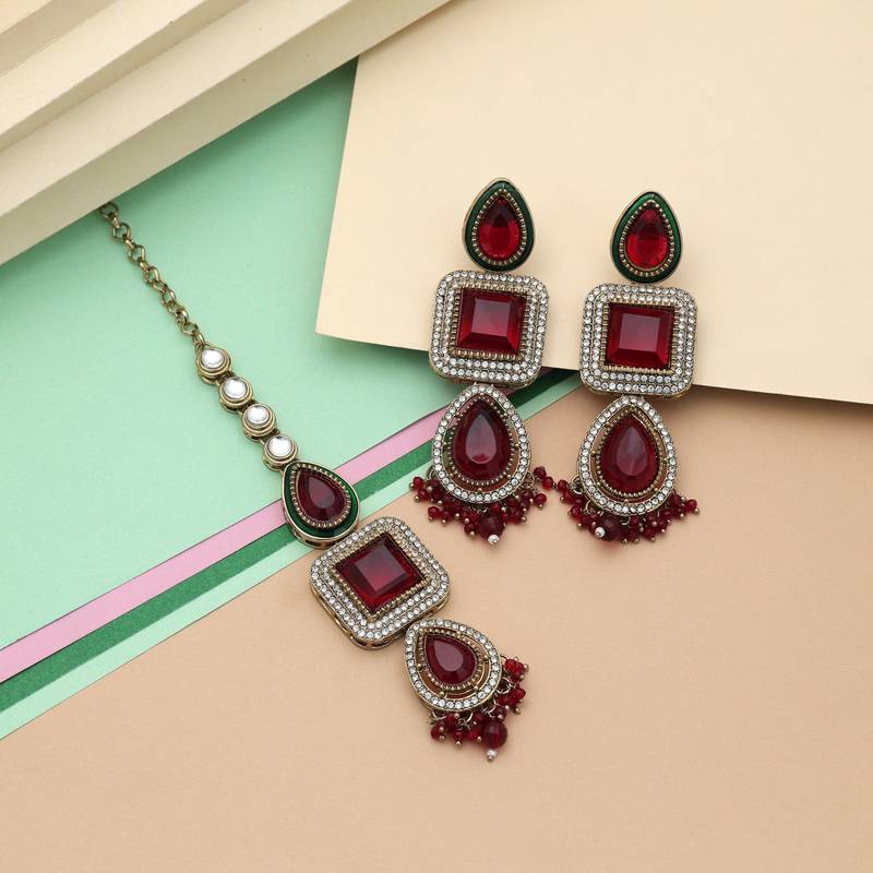 Maroon color kundan earrings tikka set