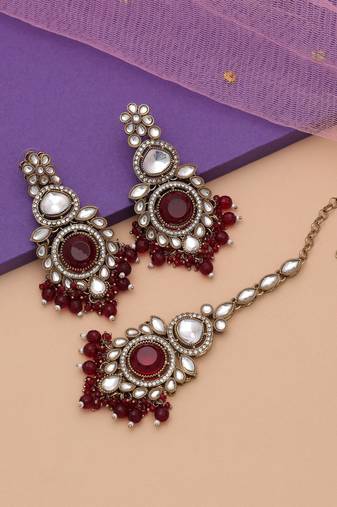 Maroon color kundan earrings tikka set