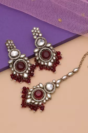 Maroon color kundan earrings tikka set