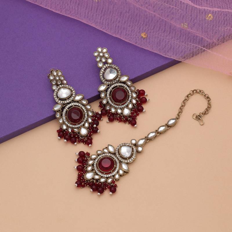 Maroon color kundan earrings tikka set
