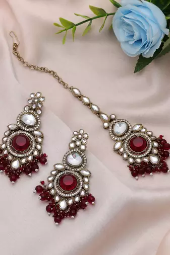 Maroon color kundan earrings tikka set