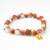 peach white charm bracelet