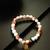 peach white charm bracelet
