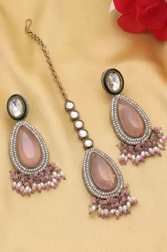 Light pink color kundan earrings tikka set