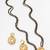gold-tone ganesh pendant and leaf chain mangalsutra set with ad stone paan pendant and earrings