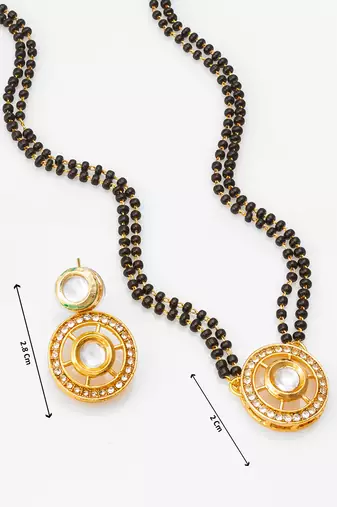 gold-tone ganesh pendant and leaf chain mangalsutra set with ad stone paan pendant and earrings