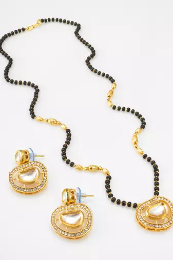kundan mangalsutra set with  polki pendant and crystal studded circular earrings