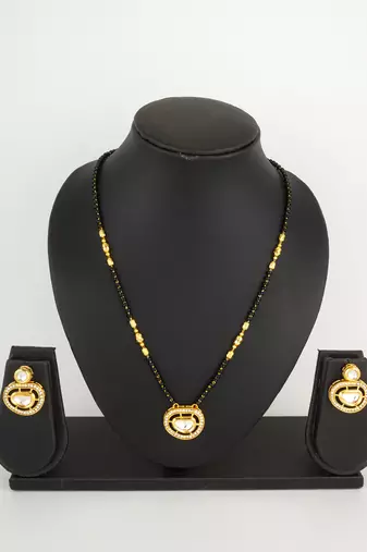 kundan mangalsutra set with  polki pendant and crystal studded circular earrings