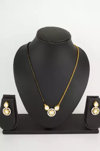 two-tone kundan mangalsutra set with polki and silver-tone crystal earrings