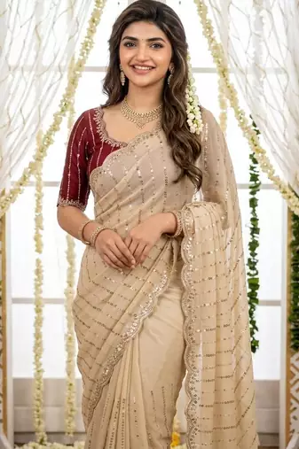 cream georgette embroidered saree with blouse