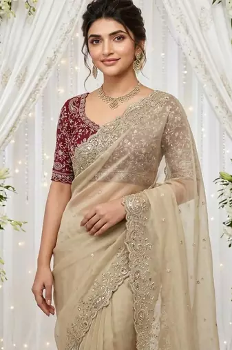 cream georgette embroidered saree with blouse