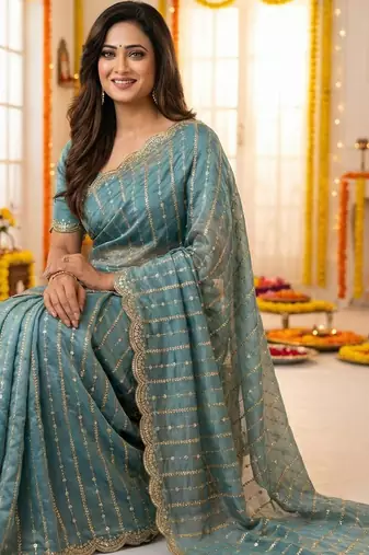sea green satin embroidered saree with blouse