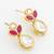 gold plated floral motif ruby and white stone drop earrings