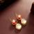 gold plated floral motif ruby and white stone drop earrings