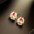 gold plated red kundan and pearl border stud earrings