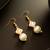 gold plated pink enamel and large pearl drop earrings