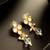 gold plated kundan and pearl drop earrings