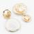 textured gold plated round statement earrings â€“ white marble finish