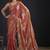 Orange polka butti work tissue silk saree with matching blouse piece