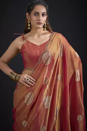 Orange polka butti work tissue silk saree with matching blouse piece