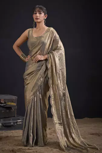 Golden polka butti work tissue silk saree with matching blouse piece