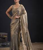 Golden polka butti work tissue silk saree with matching blouse piece