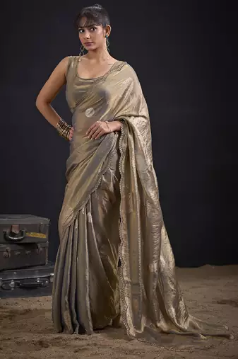 Golden polka butti work tissue silk saree with matching blouse piece