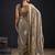 Golden polka butti work tissue silk saree with matching blouse piece
