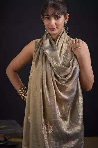 Golden polka butti work tissue silk saree with matching blouse piece