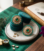 Traditional gold emerald green kundan stud earrings with beaded border for women