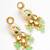 gold plated kundan earrings with meenakari peacock motif and stone drops