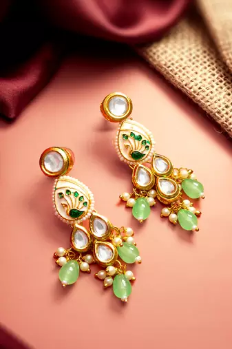gold plated kundan earrings with meenakari peacock motif and stone drops