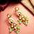 gold plated kundan earrings with meenakari peacock motif and stone drops