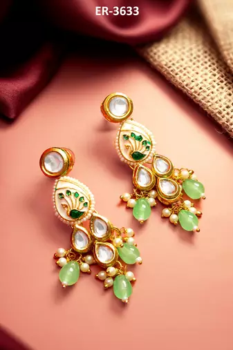 gold plated kundan earrings with meenakari peacock motif and stone drops