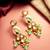 gold plated kundan earrings with meenakari peacock motif and stone drops