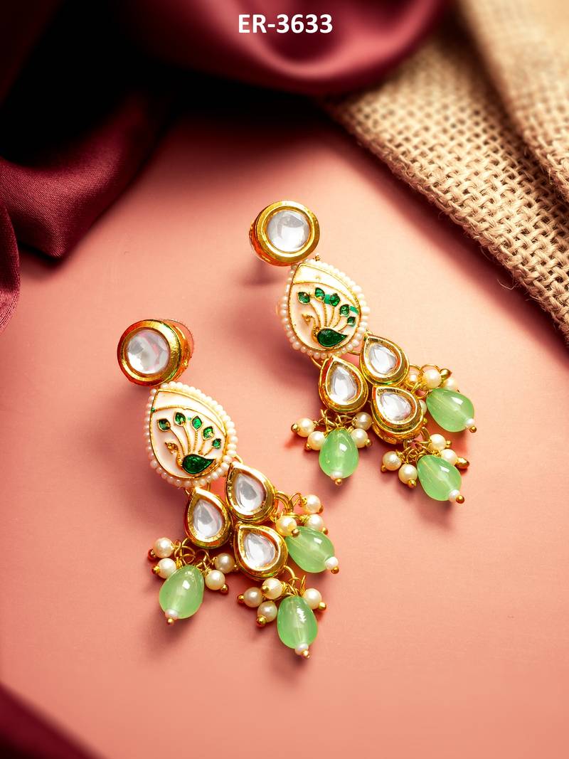 gold plated kundan earrings with meenakari peacock motif and stone drops